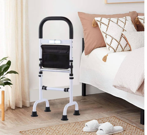 White walker with black handles next to a bed in a bedroom setting.